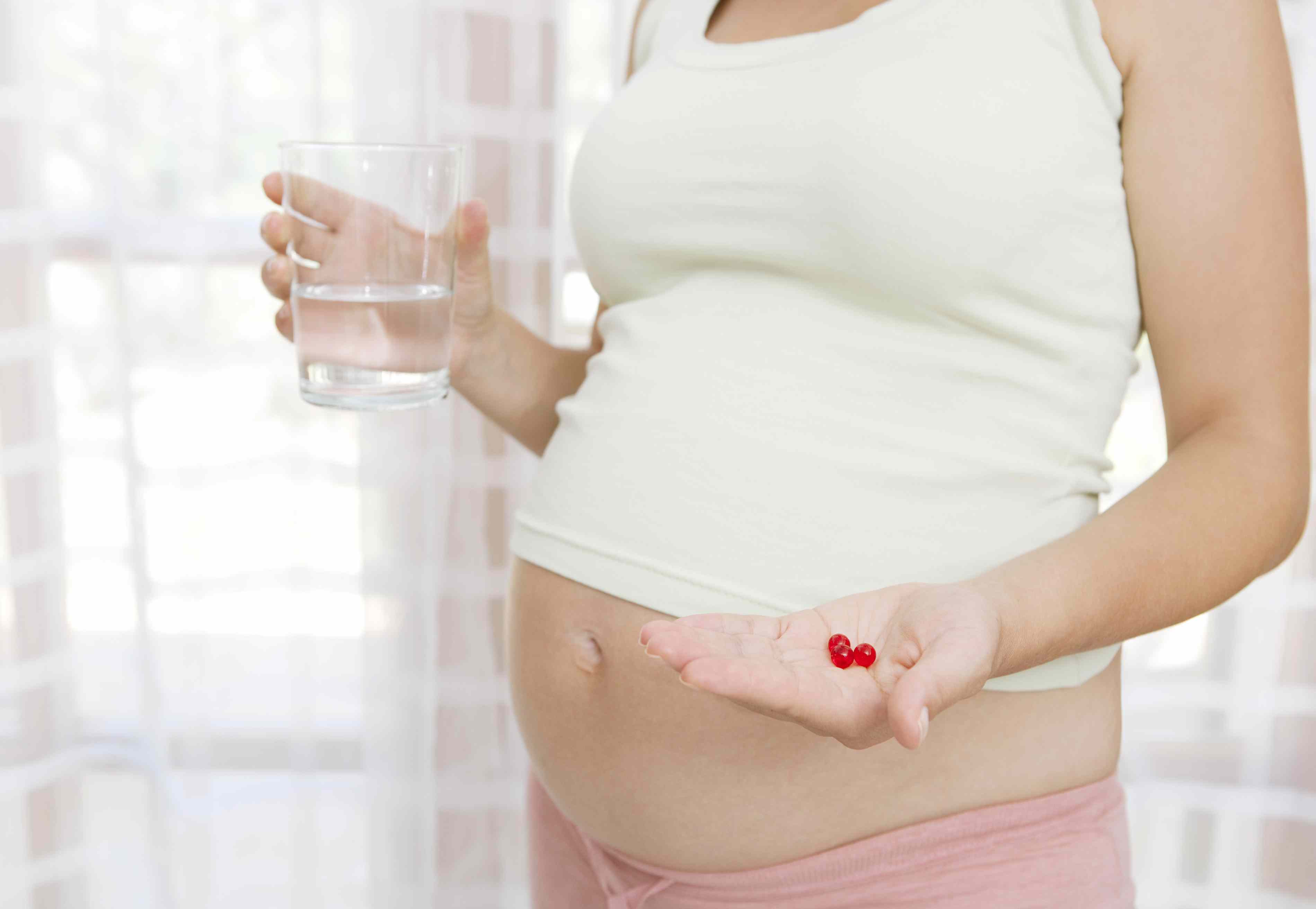 Pregnant woman taking multi-vitamins