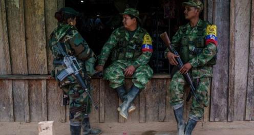 FARC rebels rest on a window of a local store at a small village in the mountains of Colombia. File Photograph: Federico Rios Escobar/The New York Times