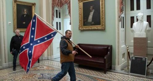 A Trump supporter carries a Co<em></em>nfederate flag in the US Capitol Rotunda last January: Ethnic violence flared between the world wars. The 1960s brought assassinations and riots so bad some northern cities o<em></em>nly half recovered.  Photograph: Saul Loeb/AFP