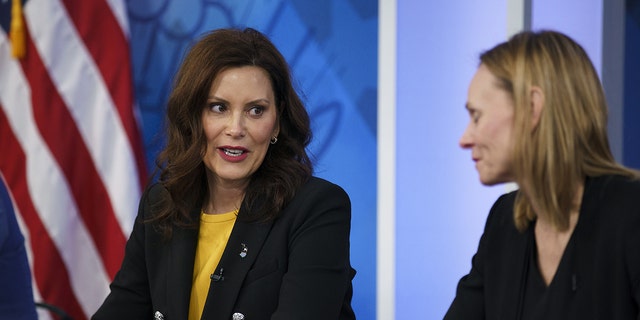 Gretchen Whitmer, governor of Michigan, left, speaks with Elizabeth Door, senior vice president of global strategic sourcing for Whirlpool Corp., before a meeting with U.S. President Joe Biden, business leaders and governors in the Eisenhower Executive Office Building in Washington, D.C., on Wednesday, March 9, 2022. 