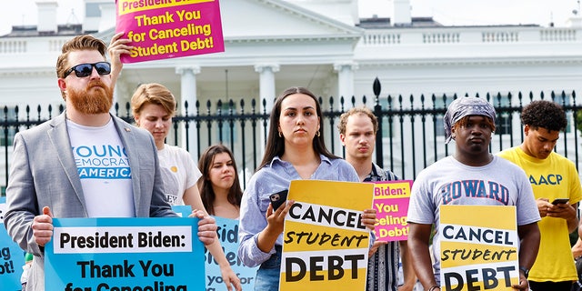 Protesters stage a rally in front of the White House to celebrate President Biden canceling student debt, Aug. 25, 2022.